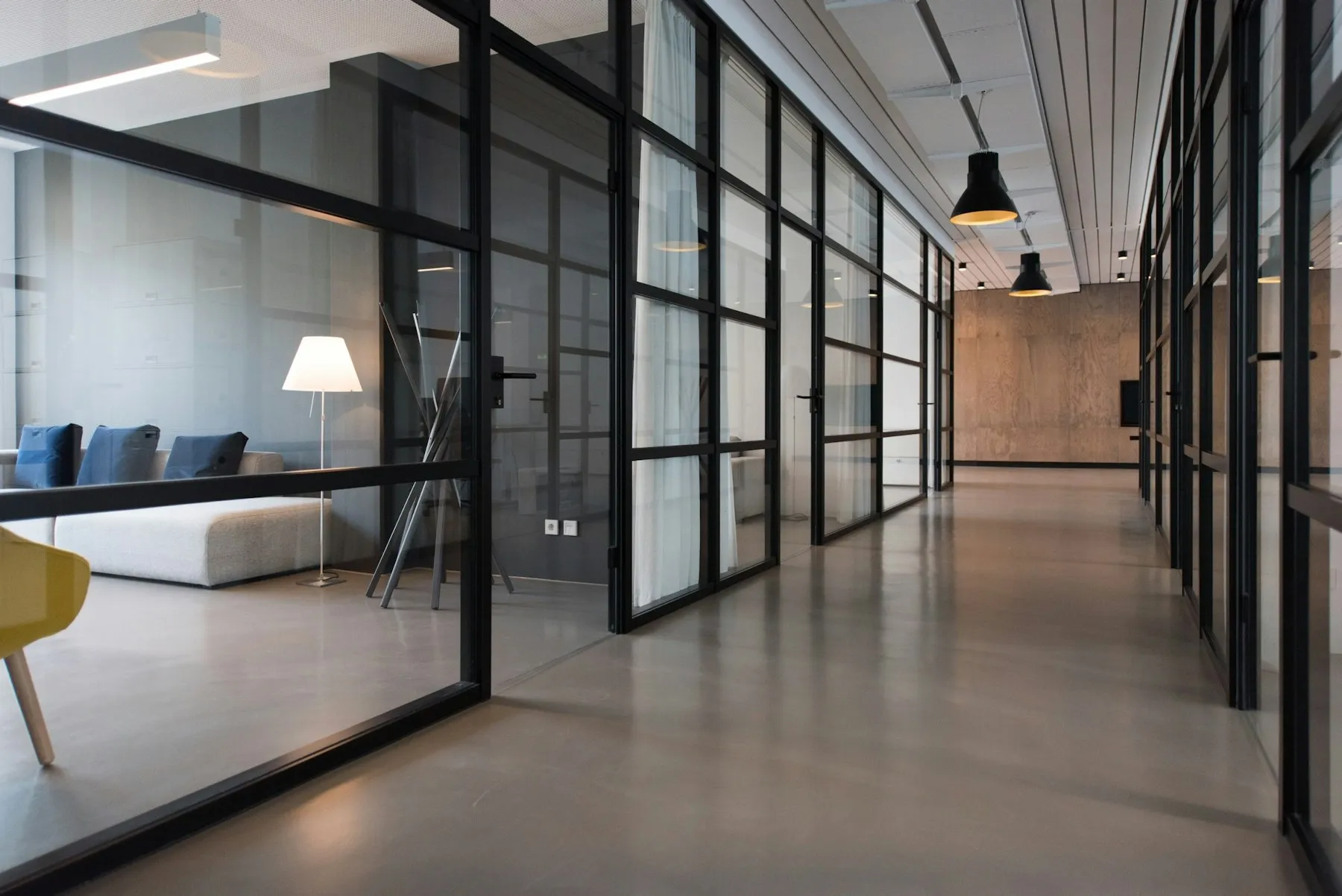 Fitted-out office corridor with glazed partition doors