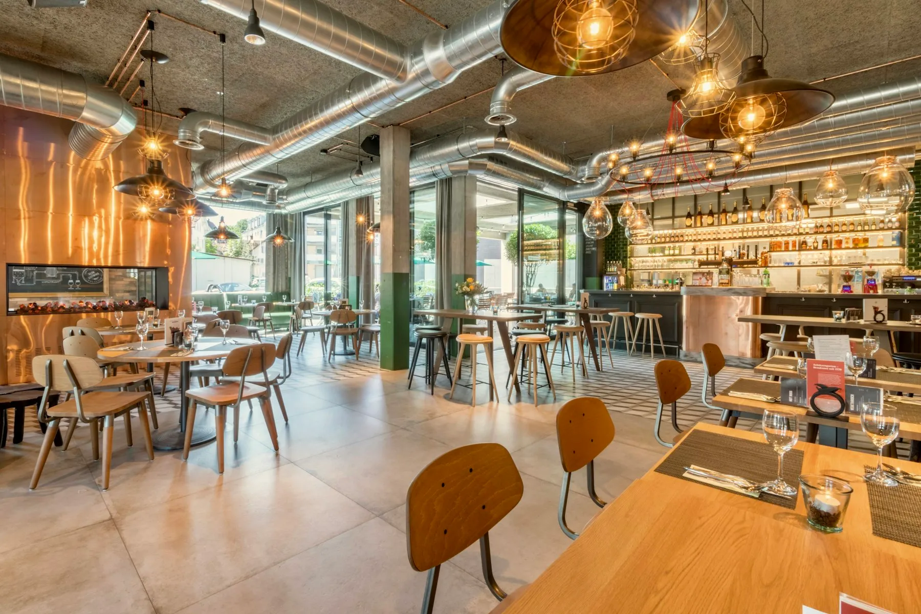 Finished restaurant interior with timber tables and warm lighting