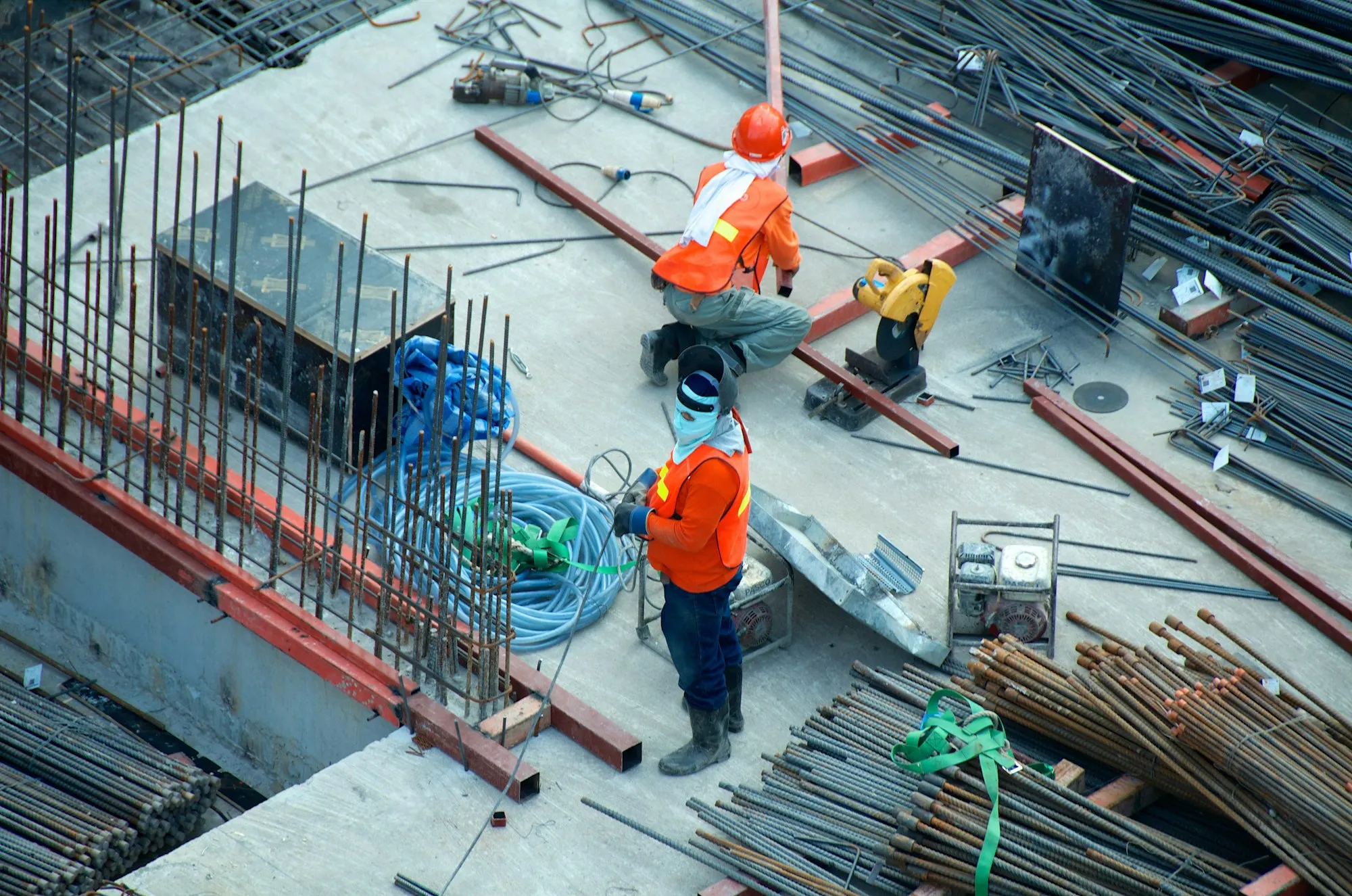 Two steel erectors working on a structural frame